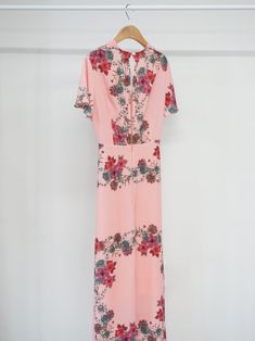 Maxi length V neck dress with short sleeve and pink floral print. Silky satin like material feel. Model is in MINUSEY S. * MINUSEY S = EU 34, US 2* MINUSEY M = EU 36, US 4* 100% Polyester* Dry clean* Made in Korea - Model Height: 170cm/5'7" (US2, EU34) Pink Floral Print V-neck Maxi Dress, Feminine Pink Printed Floral Dress, Feminine Pink Floral Printed Dress, Short Sleeve Floral Dress With Rose Print For Spring, Summer Floral Dress With Rose Print And Short Sleeves, Pink V-neck Maxi Dress With Floral Print, Short Sleeve Floral Dress With Rose Print For Summer, Feminine Floral Print Short Sleeve Maxi Dress, Pink Printed Maxi Floral Dress