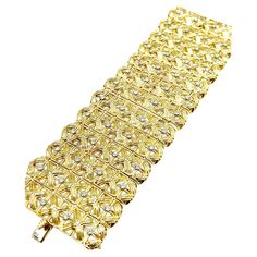 A one of a kind Cartier wide fit Diamond bracelet. The bracelet is designed with 52 round brilliant Diamonds, prong set in 18k yellow gold, combining for a total weight of 3.92 carats. The diamonds are graded as F color, VVS2-VS1 clarity. The bracelet measures 2.60 inches across and 8.00 inches in length. The links are made as a textured weave of gold, and the bracelet features a hidden box clasp. The bracelet is signed "Cartier" on the back of the bracelet and the clasp. Offered by Charles Schw Cartier Luxury Gold Diamond Bracelet, Cartier Gold Jubilee Diamond Bracelet, Cartier Luxury Gold Bracelet With 17 Jewels, Cartier Luxury Yellow Gold Diamond Bracelet, Cartier Yellow Gold Diamond Jubilee Bracelet, Cartier Diamond Bracelet, Mesh Bracelet, Wide Bracelet, Cartier Jewelry