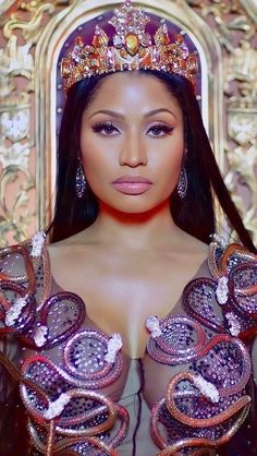 a woman wearing a tiara and posing for a photo in front of a mirror