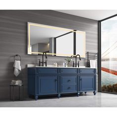 a bathroom vanity with two sinks and a large mirror