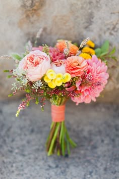 a bouquet of flowers sitting on the ground