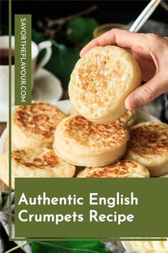 the cover of authentic english crumpets recipe is being held by a person's hand