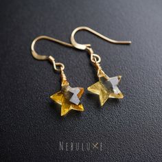 ⭐ Add a sunlit glow to your style with our Citrine Star Earrings, showcasing the warm radiance of November's birthstone crystals, embellished with celestial-inspired star accents, making them a perfect combination of elegance and celestial charm ⭐ ⭒ Material: 925 Sterling Silver / 14k Gold & Rose Gold Filled ⭒ Finish: Silver * Gold * Rose Gold ⭒ Drop Length:  2'/5cm long ⭒ Gemstone Size: 10x10mm genuine citrine star ⭒ Each pair of earrings comes with a crystal information card & stylish branded November Birth Stone Earrings, Celestial Star-shaped Crystal Earrings Gift, Celestial Star-shaped Crystal Earrings For Gift, Celestial Star-shaped Crystal Earrings, Handmade Yellow Star-shaped Jewelry, Handmade Yellow Star Jewelry, Star-shaped Crystal Earrings For Gifts, Birthstone Crystals, November Birthday Gifts