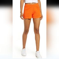 Eadie High Waist Rib Shorts In Orange Combining Sporty Ease With Classic Versatility, These High-Rise Shorts In A Soft Rib Knit Are Ones You'll Choose To Wear Again And Again. Fitted Cotton Athletic Shorts For Spring, Athleisure Bottoms For Spring Day Out, Athleisure Bottoms For Day Out In Spring, Orange Bottoms With Built-in Shorts For Loungewear, Sporty Bottoms With Short Inseam For Spring, Sporty Short Inseam Bottoms For Spring, Spring Sports Shorts With Ribbed Waistband, Relaxed Fit Athleisure Bottoms For Day Out, Fitted Shorts With Ribbed Waistband For Summer