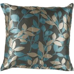 a blue and brown pillow with leaves on it