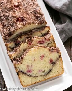 a loaf of strawberry bread on a white plate