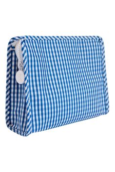 a blue and white gingham bag with buttons on the front, sitting against a white background