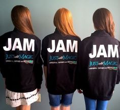 three women wearing jackets that say jam and just add magic on their back, standing in front of a wall