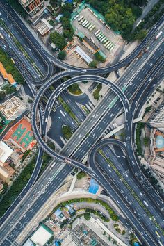 an aerial view of two intersecting roads in the city