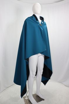 The core component to the Switch Cloak is the backing cape. This waterproof, comfortable blanket converts from a picnic style blanket into the wearable rain poncho covered with a renaissance-style hood. The blanket comes with four stake holes and a bag of staking nails to keep it in place. It also comes with the connectors for a Switch Badge™ or the close-tie connections more in place with a cape. Available in grey, red, black, blue, and teal. Free shipping to Colorado. 🌄 🏔️ 10% of annual net- Cloak Poses, Jedi Outfit Concept Art, Cloak Designs, Wizard Core, Side Cape, Cloak Pattern, Jedi Outfit, Cute Animal Quotes, Poncho Design