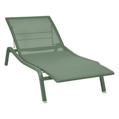 a green lounge chair with an arm rest