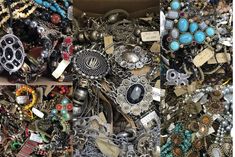 there are many different types of necklaces in the box and one is for sale