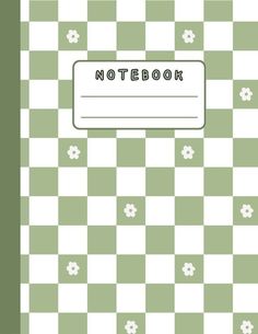 the notebook is sitting on top of a checkerboard surface with flowers and leaves