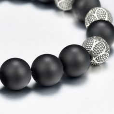 Genuine Black Onyx Bead Bracelet for Men or Women Steel Cable With Custom Silver Magnetic Clasp & Custom Silver Beads 10mm - AAA Quality Black Onyx Premium Bead Bracelet with round 10 millimeter black onyx beads combined with a silver magnet logo clasp. Comes with a premium leather logo box. You will not find the quality of beads I use which are 5A quality rated, the custom silver beads and high quality custom made silver clasp I use for my bracelets at any where close to the value I offer. Silver Stretch Bracelet With Black Beads, Formal Adjustable Beaded Bracelets With 8mm Beads, Silver Bracelets With Black Round Beads, Silver Bracelet With Round Black Beads, Luxury Silver Bracelets With Gemstone Beads, Luxury Silver Bracelet With 8mm Beads, Silver Beaded Bracelets With Black Round Beads, Silver Beaded Wristband With Round Beads, Luxury Black Bracelets With 8mm Beads