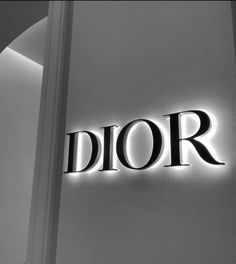 the word dior is lit up in black and white