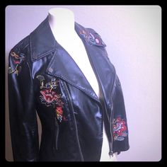 Black With Embroidered Flowers Throughout. Moto Faux Leather With Zippers On Sleeves Also. 100% Polyurethane Lining. 100% Polyester See Photos For Complete Details Of This Beautiful Moto Jacket. Embroidered Biker Leather Jacket For Fall, Fitted Leather Jacket With Floral Embroidery For Winter, Embroidered Biker Jacket For Winter, Winter Floral Embroidered Fitted Leather Jacket, Embroidered Fitted Leather Jacket For Fall, Fall Fitted Embroidered Leather Jacket, Fitted Embroidered Leather Jacket For Fall, Fitted Leather Jacket With Floral Embroidery, Fitted Embroidered Leather Biker Jacket