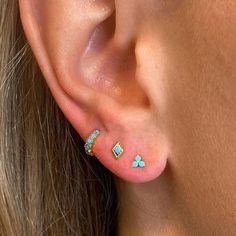 The perfect addition to any summer ear party. The Turquoise Trinity Studs are the freshest pop of color you can add to any ear stack, or wear them solo for a crisp look. DETAILS & SIZE Sold as a pair Composition: 18K gold plated over .925 sterling silver or solid .925 sterling silver; CZ stones Measurements: Stones: 1mm Comes with push-back ear nuts Read about how to care for your jewelry here. Shop the Ear Bar to curate your ear stack! Ear Bar, Ear Party, Flat Back Earrings, The Trinity, Ear Stack, Anklet Bracelet, Chain Earrings, Steel Jewelry, Stainless Steel Jewelry