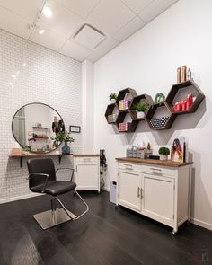 a salon with white walls and wooden floors