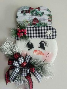 a snowman decoration hanging on the wall