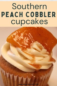 there is a cupcake with white frosting and orange icing on top that says southern peach cobbler cupcakes