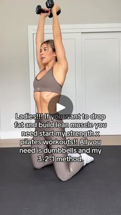 a woman is doing squats with dumbbells on her chest and arms behind her head