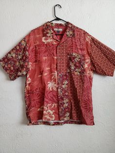 Vintage Hawaiian shirt by Tommy Bahama. Short sleeve all silk. Coral orange patchwork print, floral size medium mens . A women's large. Pit to pit back panel is 24 inches. Lightweight, breezy, surfer dude, beach bum, Key WestJimmy Buffett and Margaritaville. Gender neutral. Classic beach wear. Cotton Patchwork Shirt For Vacation, Casual Short Sleeve Top With Floral Patchwork, Beach Tops With Patchwork And Short Sleeves, Short Sleeve Patchwork Top For Vacation, Patchwork Short Sleeve Tops For Beach, Patchwork Short Sleeve Top For Vacation, Casual Short Sleeve Tops With Mixed Print, Casual Beach Patchwork Top, Long Sleeve Hawaiian Shirt With Floral Print For Beach