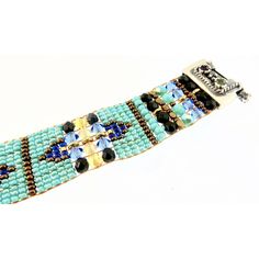 CHILI ROSE Blue Desert Cowboy Gemstone Bracelet Adonnah Langer hand looms Czech and Japanese seed beads with Czech fire-polished and brass beads woven into spectacular intricate designs Gorgeous Southwest pattern with stunning combination of Blue, Turquoise , Jet and a hint of Cornflower Perfect accent for Jeans & Tee! The end caps and clasp are all set sterling silver .925 with gemstones of Garnet-Citrine-Blue Topaz (All of which may be customized) -Bracelet measures as shown 6 3/4 inch end to Desert Cowboy, Chili Rose, Blue Desert, Native American Rugs, Southwest Pattern, Customised Bracelets, Hand Looms, Brass Beads, Rose Blue