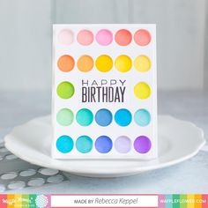 a happy birthday card on a white plate with polka dots and the words happy birthday