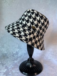 Highly recommended by seller.  Beautiful and stylish houndstooth pattern bucket hat to keep your head warm in cold season. Adult size, one size fit all ; suitable for head circumference 56-58cm Approximately 3 1/3 inches high, 3 inches brim Plaid Short Brim Hat For Winter, Winter Plaid Hat With Short Brim, Plaid Short Brim Winter Hat, Retro Winter Bucket Hat With Curved Brim, Retro Curved Brim Bucket Hat For Winter, Adjustable Brimmed Hat With Herringbone Pattern, Winter Retro Curved Brim Bucket Hat, Plaid Short Brim Hat For Fall, Plaid Short Brim Fall Hats