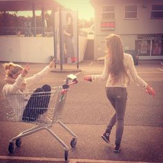 two women pushing a shopping cart with the words thanks for being my unbiological sister