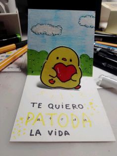 a card with an image of a pikachu holding a heart