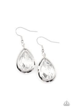 pair of silver earrings with clear crystal tears on white background, close up photo