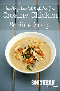 creamy chicken and rice soup in a white bowl on a wooden table with text overlay