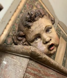 a close up of a statue of a child's head