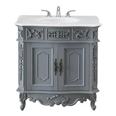 a bathroom vanity with an ornate design on the top and bottom, in grey color