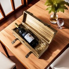 an open wine box sitting on top of a wooden table