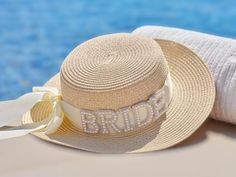 👒 Shine bright on your special day with our Pearl Bride Sun Hat! 👒 Perfect for weddings, engagements, bachelorette parties, bridal showers, honeymoons, and summer travels, this elegant sun hat features a beautiful pearl design and "Bride" embroidery. Made from high-quality materials, it provides excellent sun protection while adding a touch of glamour to your beach or poolside look. This hat is a thoughtful and stylish gift, ensuring the bride stands out in style on all her special occasions. Bride Straw, Bachelorette Party Hat, Pool Wedding, Bachelorette Party Weekend, Hen Party Accessories, Ginger Ray, Hen Party Gifts, Pearl Letters, Pearl Bride