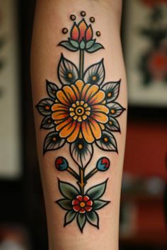 a woman's leg with a flower tattoo on it