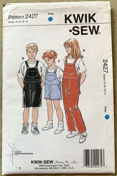 two children's overalls and an apron sewing pattern on a piece of paper