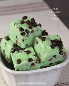 mint chocolate chip fudge in a white bowl on top of a table with napkin