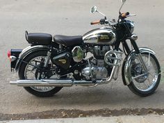 a black and silver motorcycle parked on the street