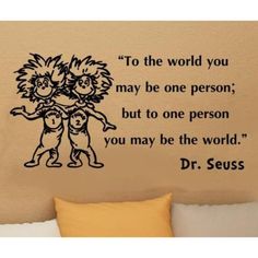 dr seuss quote wall decal with two children hugging each other in front of a couch