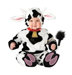 a baby dressed in a cow costume