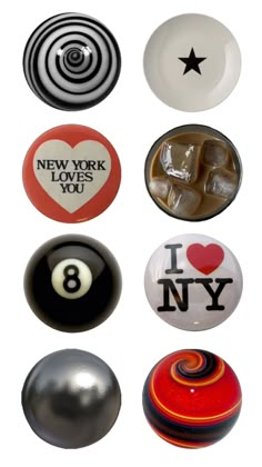 several different types of buttons and magnets on a white background with the words i love new york