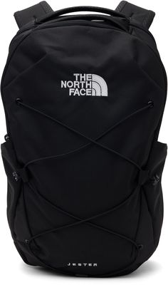 Recycled canvas backpack in black. · Water-resistant, Non-PFC DWR-coated · Rolled carry handle · Padded FlexVent™ Suspension System shoulder straps · Press-release sternum strap · Logo embroidered at face · Crisscrossing bungee-style drawstring · Mesh patch pocket at sides · Padded jersey panel at back face · Two-way zip closure · Laptop compartment at interior · Canvas lining · H18 x W11 x D5 Supplier color: TNF black Jester Backpack, North Face Bag, Tan Face, Recycled Canvas, Bags Logo, Embroidered Bag, Black North Face, Canvas Backpack, Men's Backpack