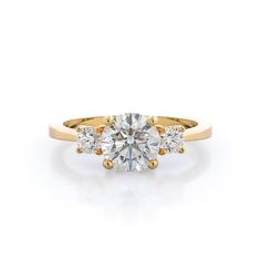 a three stone engagement ring with two diamonds on the band and one diamond in the center