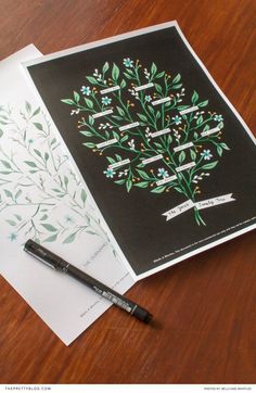 an image of a tree with leaves on it next to a notepad and pen