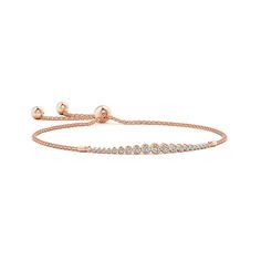 Graduated round diamonds sparkle along this elegant 14k rose gold bracelet. They are held in a sophisticated bezel setting. This bolo bracelet is adjustable to fit most wrists. 14k Rose Gold Bracelet, Solid Gold Bracelet, April Birthstone Jewelry, Bolo Bracelet, Bezel Set Diamond, Unique Bracelets, Yellow Gold Bracelet, Diamond Bracelets, Adjustable Bracelet