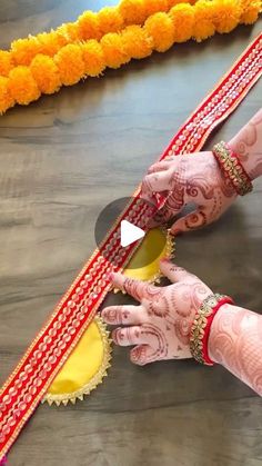 two hands with henna on each hand