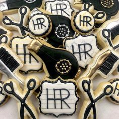 decorated cookies with scissors, combs and hairdryers on top of each other